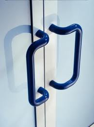 nylon coated handles, warm to the touch, in a contrasting colour such as these will comply with the dda