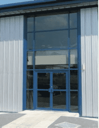 commercial door with hold open device