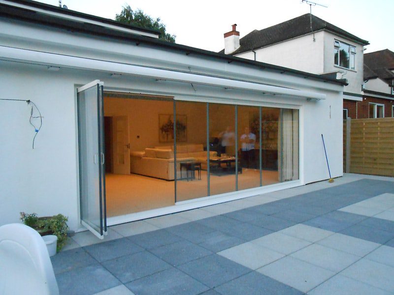 frameless bifold doors slide and fold in new extension