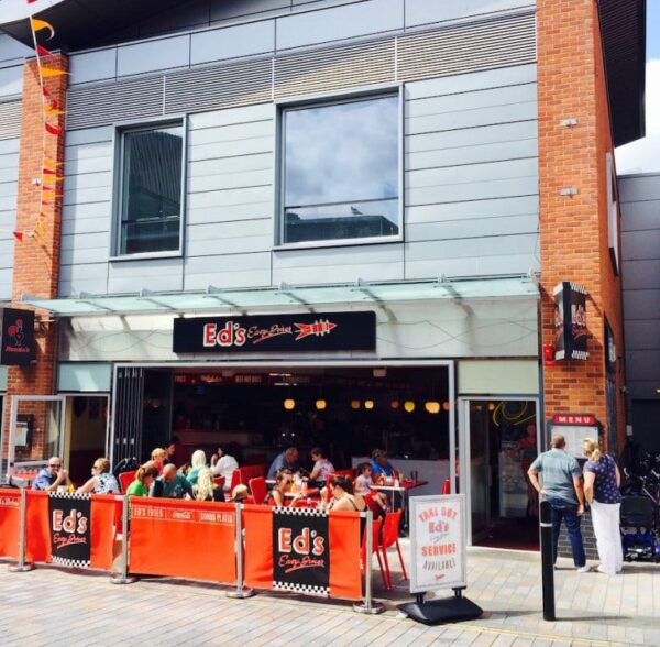 aluk bifolding doors in a nando's restaurant, fully open