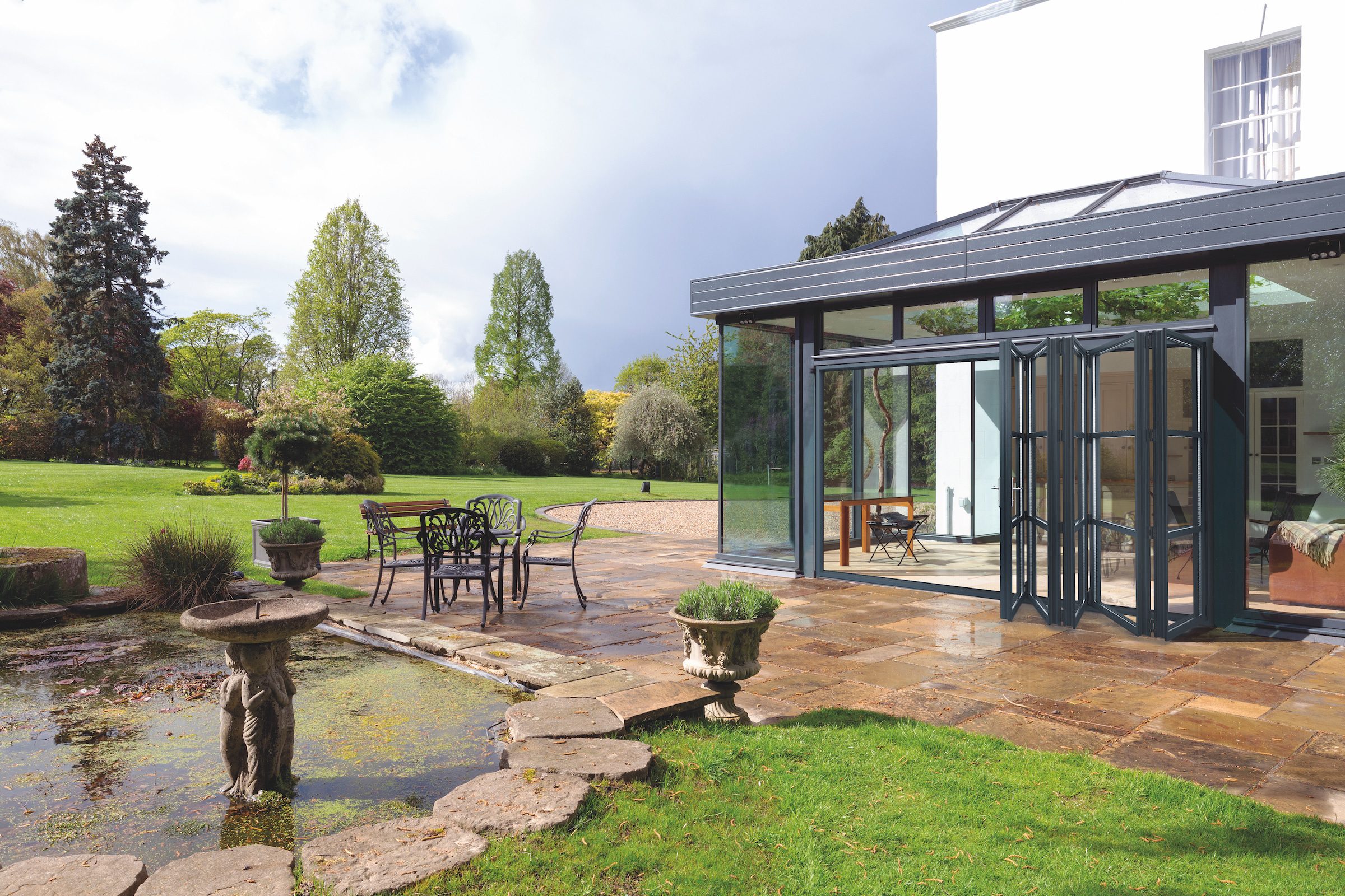 smart systems grey bifolds in a glass extension country home