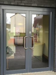 these doors are a main entrance to a recently built retirement village but are in the same colour with contrasting handles. 