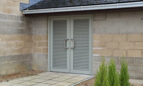 aluminium louvre doors in a block of flats bin store