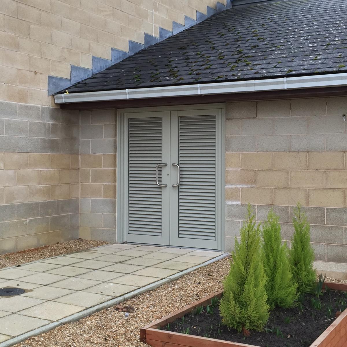 aluminium louvre doors in a block of flats bin store