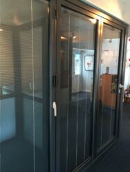 these schuco bifolding doors feature integral glass blinds from market leading morley glass.