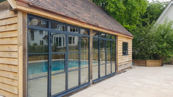 bifold doors for garages in a timber structure and crittall style