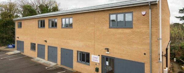 origin windows have been successfully installed in this commercial building used by a local scout group. 