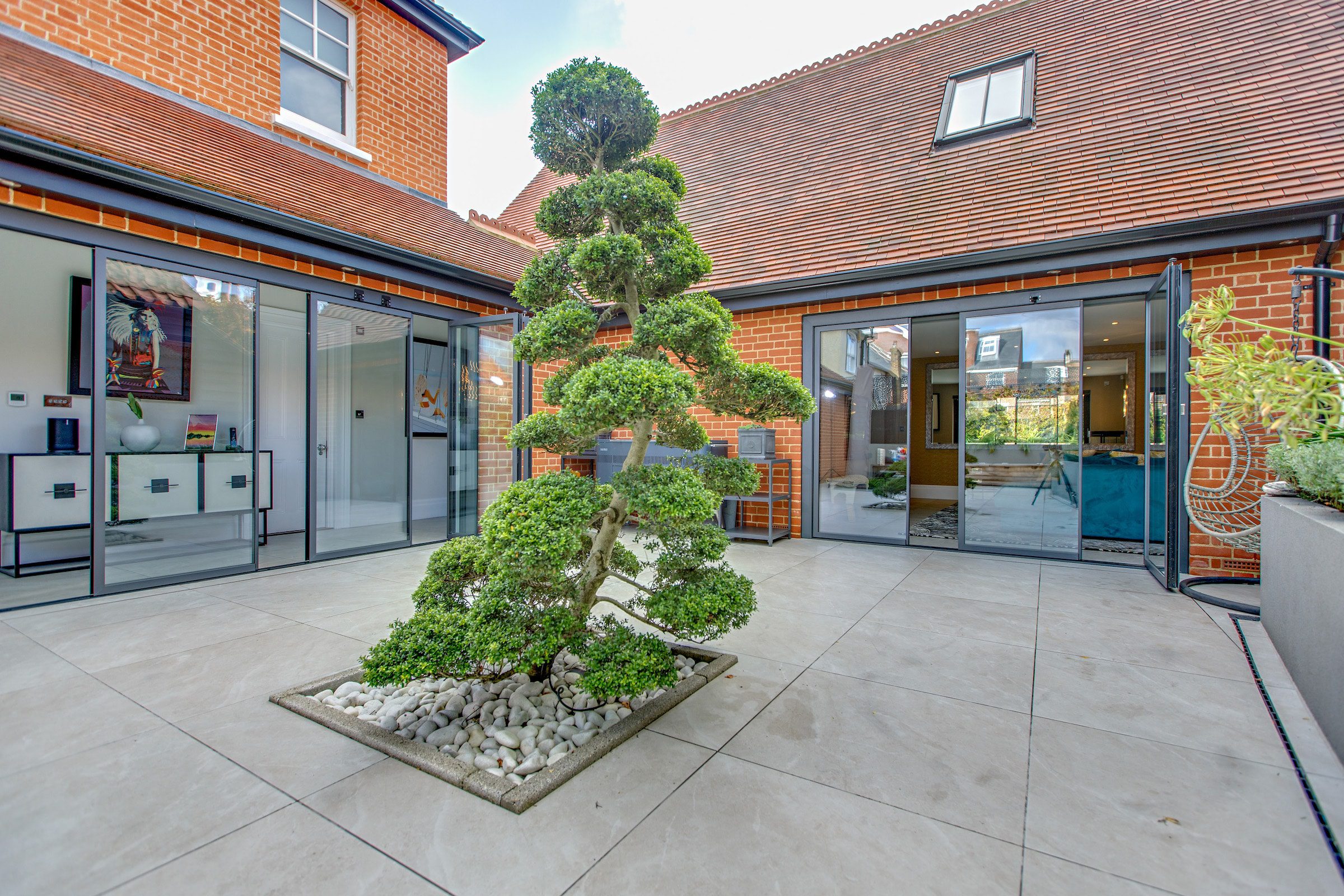 slide and stack doors fitted in a courtyard setting 