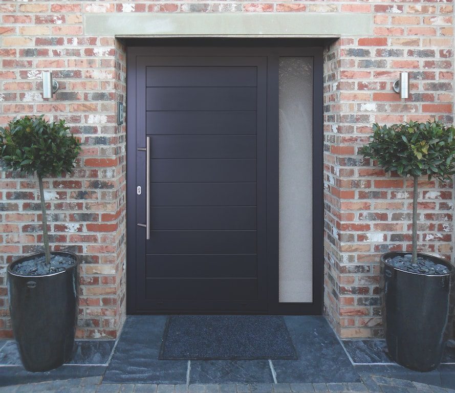 contemporary aluminium front door in a brick-built house