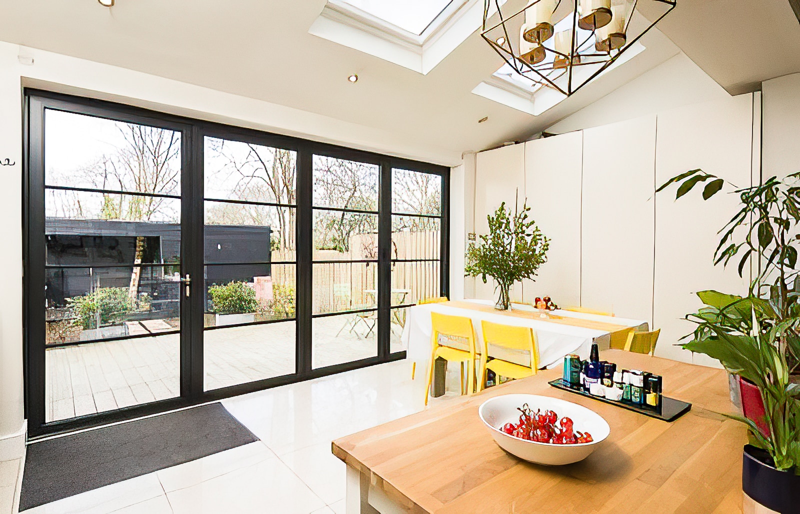 the origin ob-49 bifolding door in the steel look to a house extension