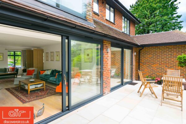 aluminium doors and windows maintenance showing a large set of grey sliding doors