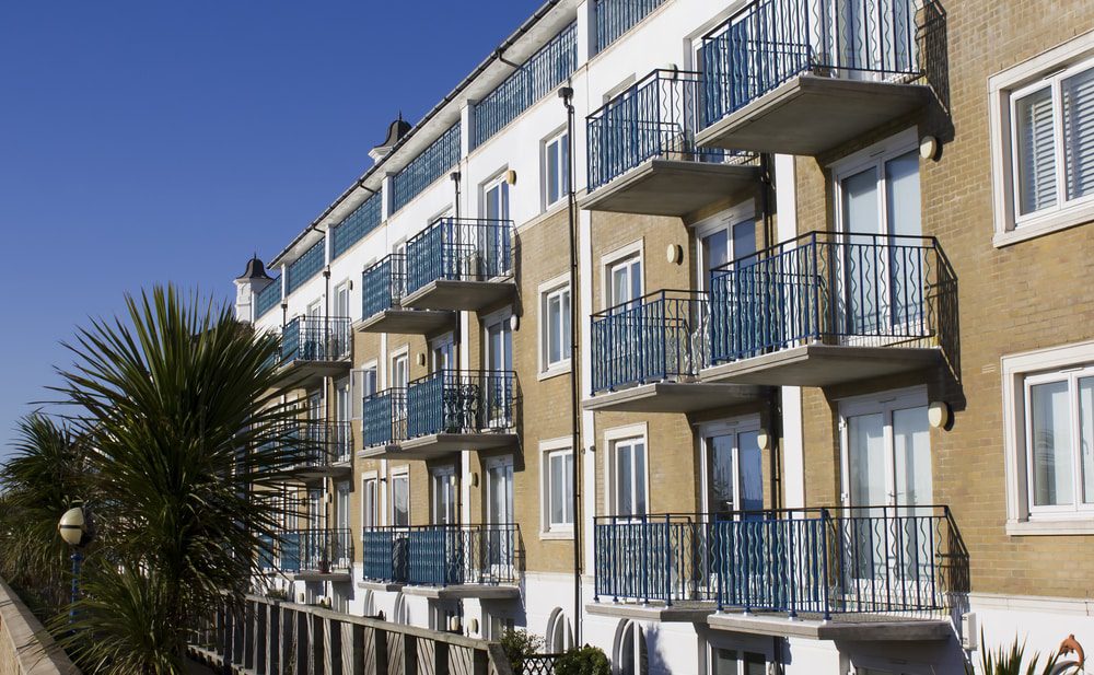 technal uk sliding doors and windows in a modern block of apartments