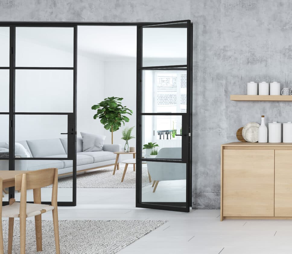 steel look doors separating a kitchen and lounge 