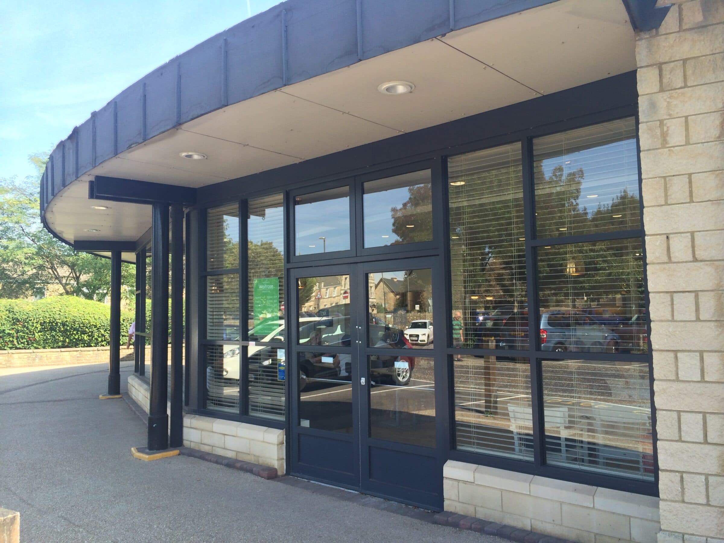 grey commercial shopfronts and screens