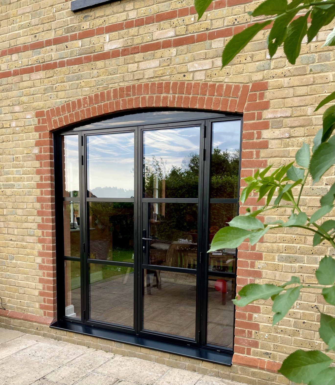 aluminium crittall style door in black in a traditional house