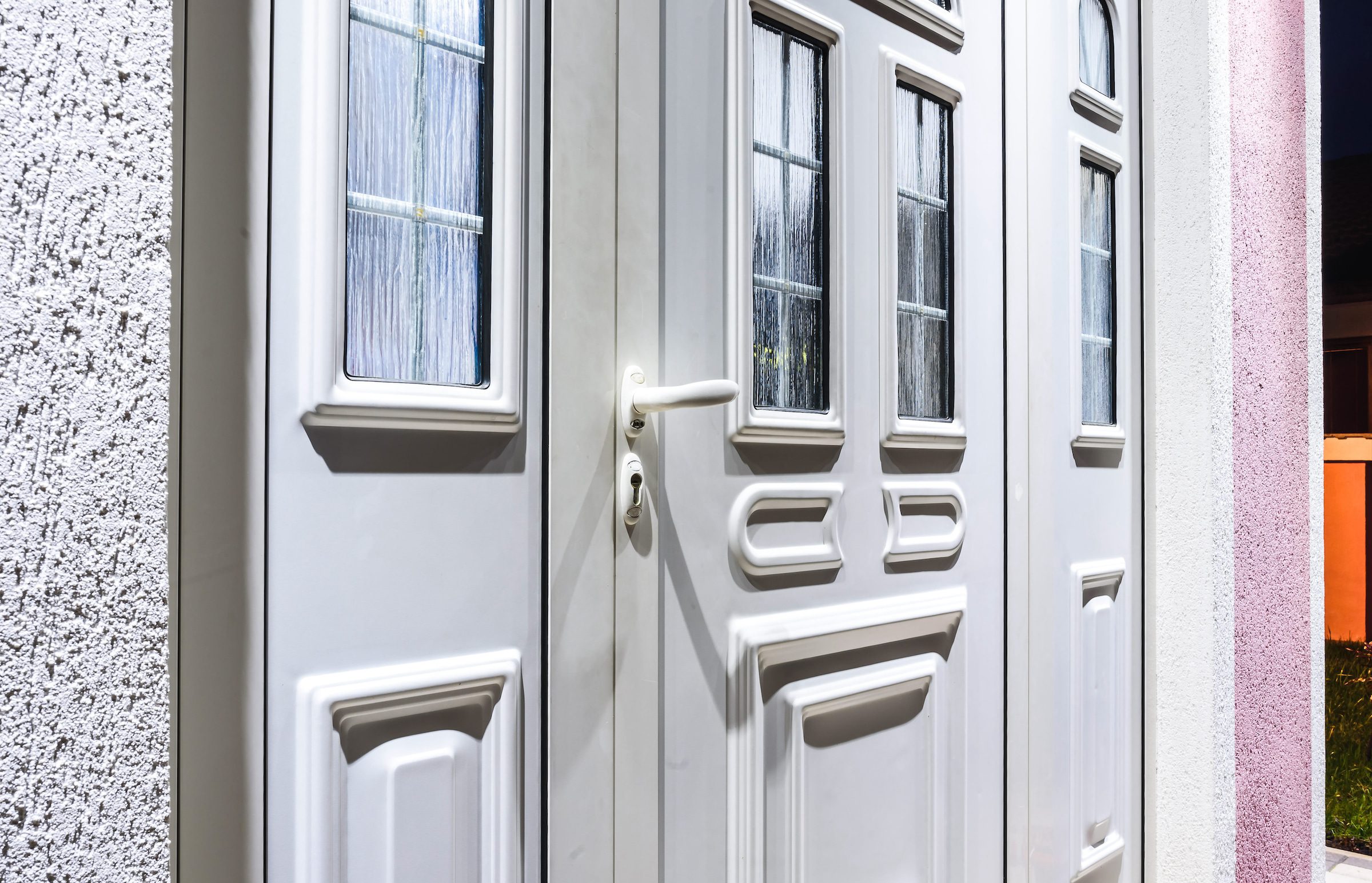 new entrance door in white pvcu with matching side panels