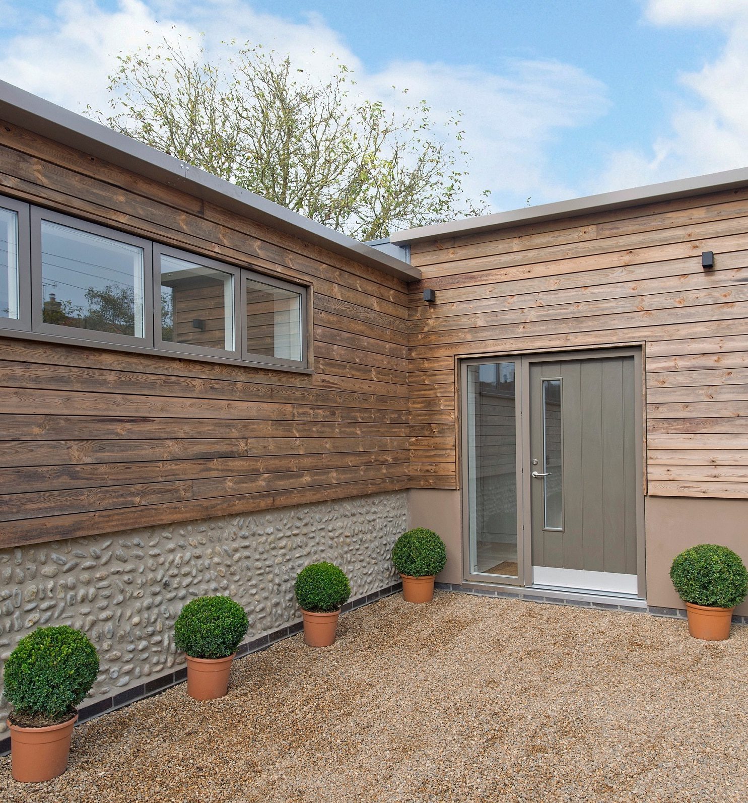 modern grey hybrid entrance door in a timber house