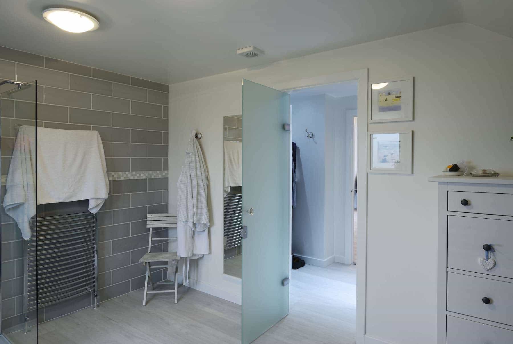 internal glass door between a bedroom and ensuite with frosted glass