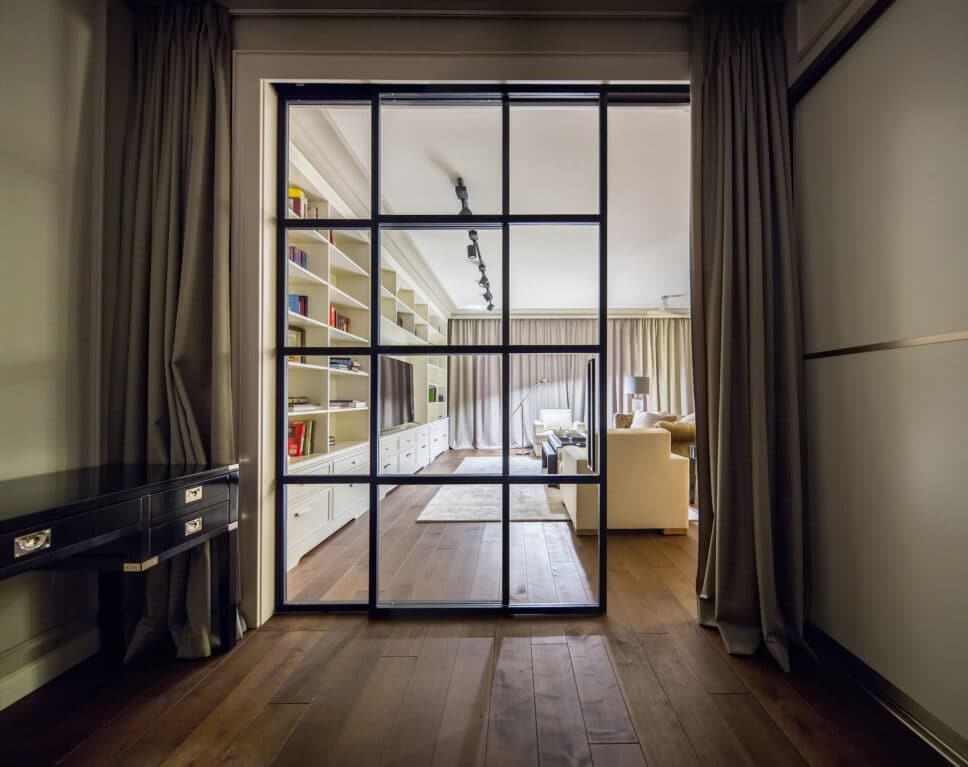 aluminium internal sliding door separating a hallway from the lounge