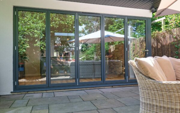 schüco ass fd75 bifold door in a modern extension