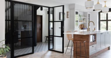 aluco steel look internal doors in a kitchen renovation with tiled floor and kitchen island