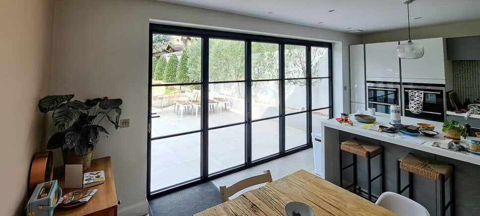 picture of the latest origin frames ltd steel look bifolds in a modern refurbished kitchen