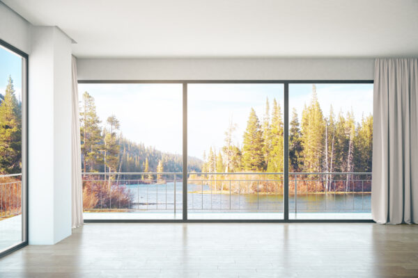 cortizo cor vision sliding doors in a modern room with lakeside views