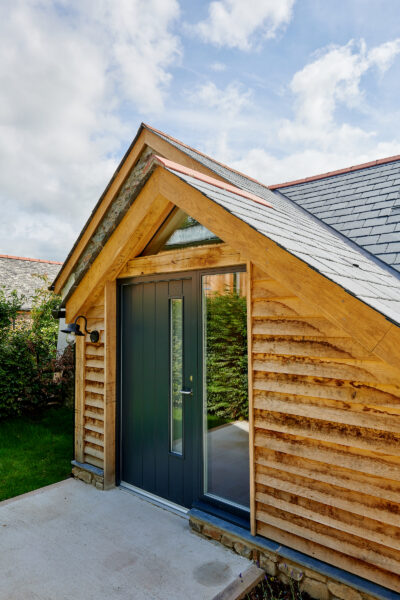 rationel front door in a timber gable porch design