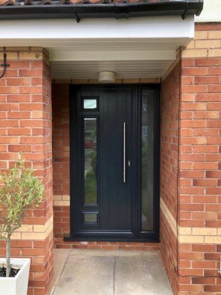 truedor contemporary front door set back in a brick porch