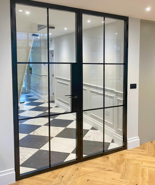 aluco floating lock slimline internal double door leading into panelled hallway