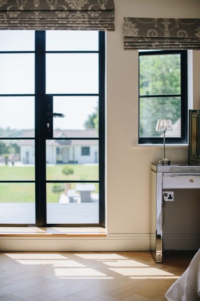 aluco window and steel-look door in a sunlit room