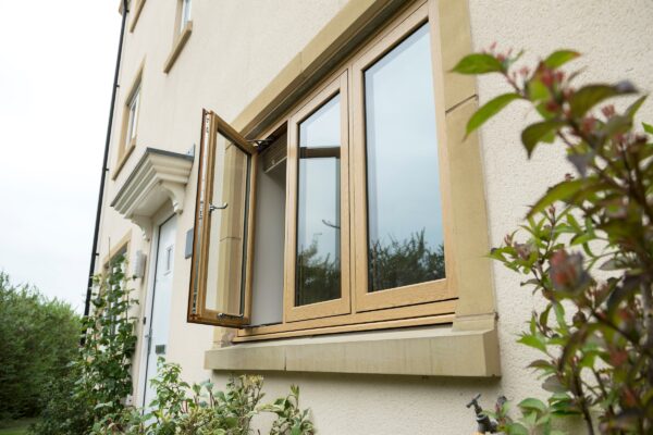 deceuninck flush upvc  casement window in an oak finish, new build house. 