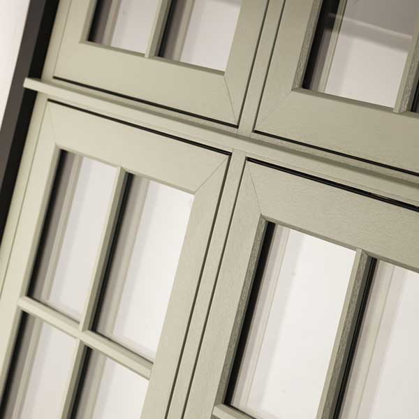 residence 9 vs evolution  windows, explanatory image of upvc flush window outside view in sage green