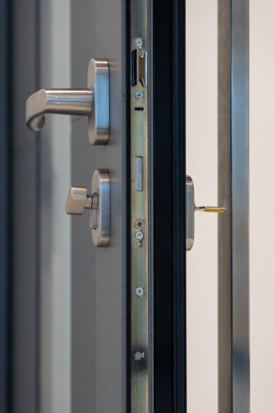 close up picture of modern aluminium door lock and handle