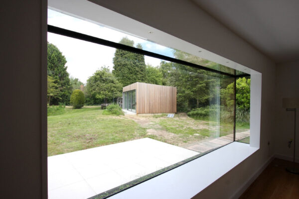 picdture of large oriel window with window seat and glass roof