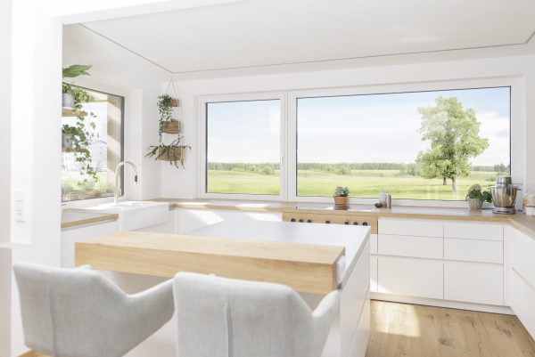 internorm upvc windows in a modern kitchen diner with landscape views