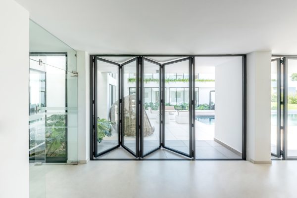 cortizo bifold doors in a modern home, white clean decor