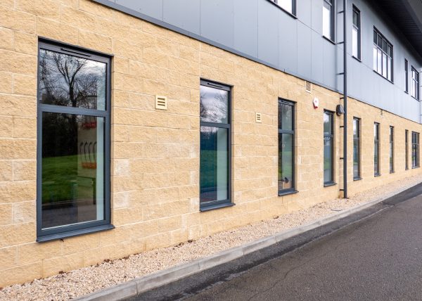 commercial building with brickwork and cladding and schuco aws 80 sc windows.