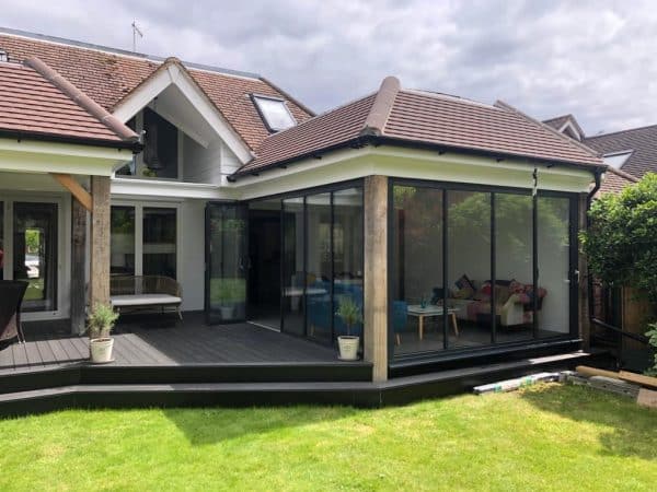 sunroom fitted with slide and turn doors