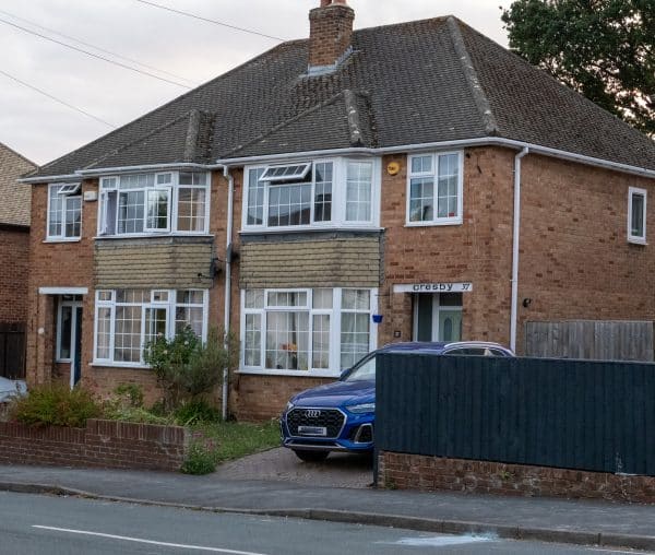 a typical three bedroom semi-detached house with aluminium windows to explain aluminium window prices in 2026
