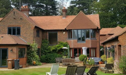 origin aluminium windows in a grey colour fitted in a large surrey house