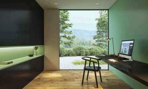 alumil s85 casement window in a stylish office with forest views