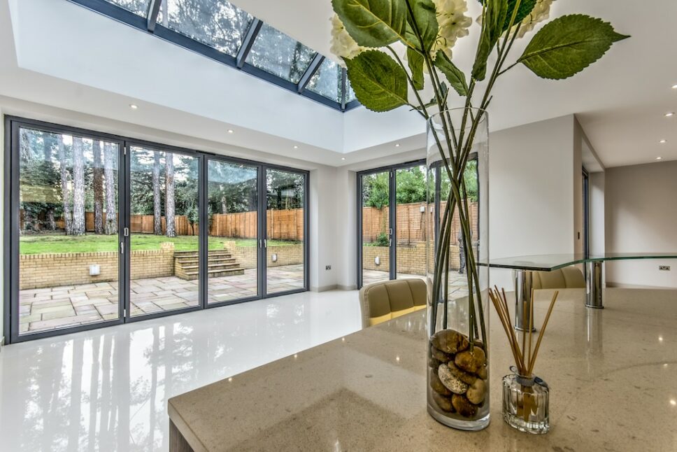 alumil bifolding doors in a luxury home setting with lantern roof