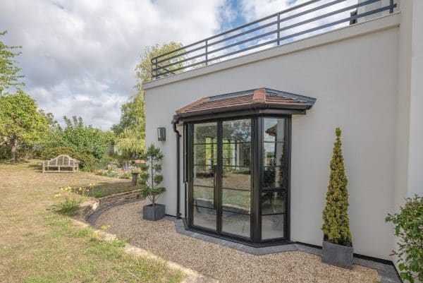 aluco steel look aluminium french doors in a bay window design