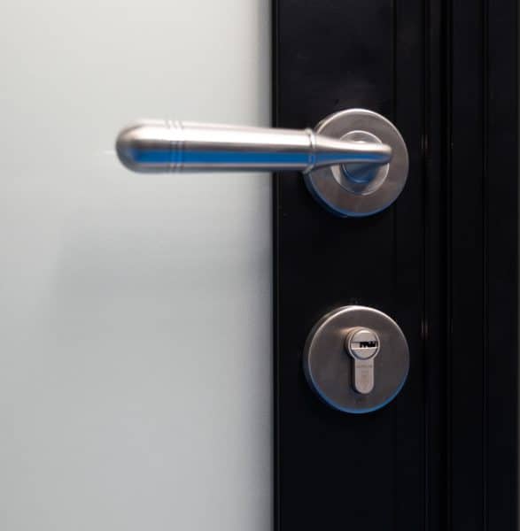 close up of french door lock with period handle and separate key cylinder