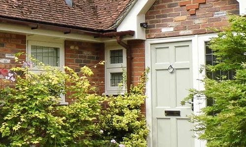 understanding front door cost: options and prices explained 1 the english door made by evolution windows in a traditional house porch