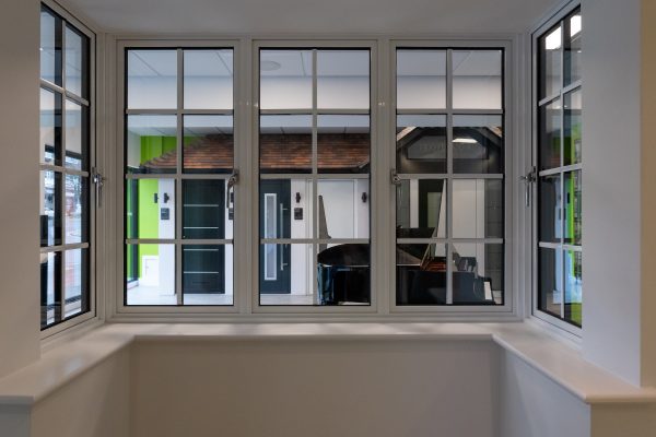 inside view of alitherm aluminium white bay window in a double glazing showroom