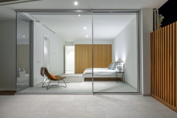 cortizo sliding doors in a contemporary bedroom setting