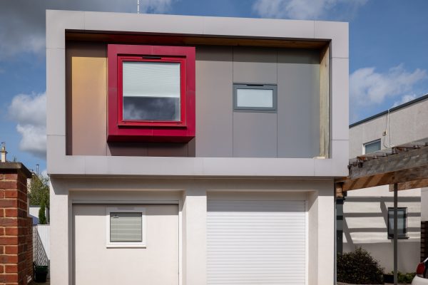 contemporary house front with prominent red window
