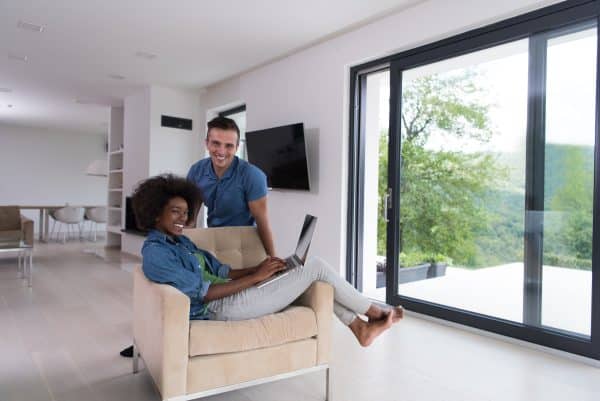 picture of couple on sofa in front of their sliding doors